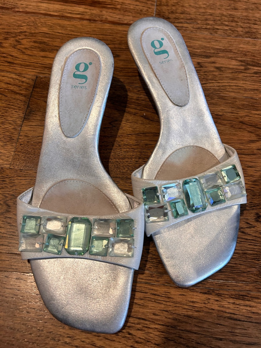 Cole Haan Silver Slide Mules with Green Gem Accents